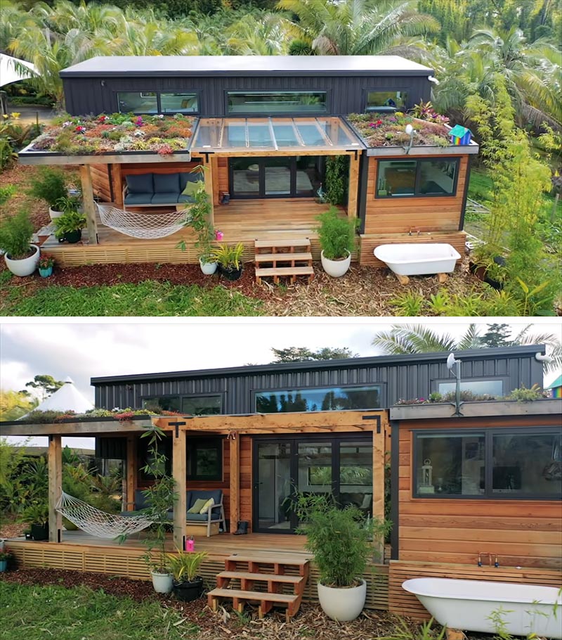 A modern tiny house with a porch and green roofs, that uses cedar siding and colored steel for the exterior materials.
